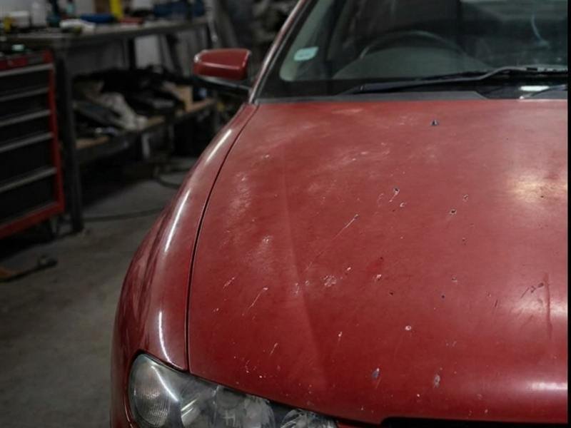 Faded and chipped bonnet before respray